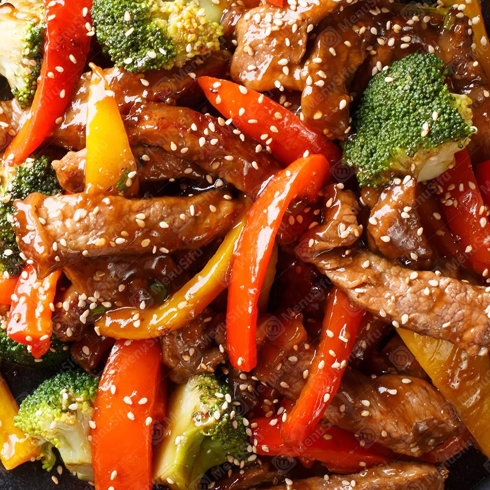 Sesame beef stir-fry with bell pepper and broccoli in brown sauce at Bamboo Bowl Kitchen, a Chinese Restaurant in Moreno Valley